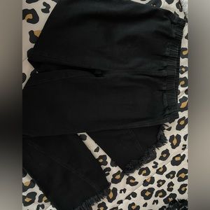 Stretchy waist boutique bell bottoms, black with rips in the knees